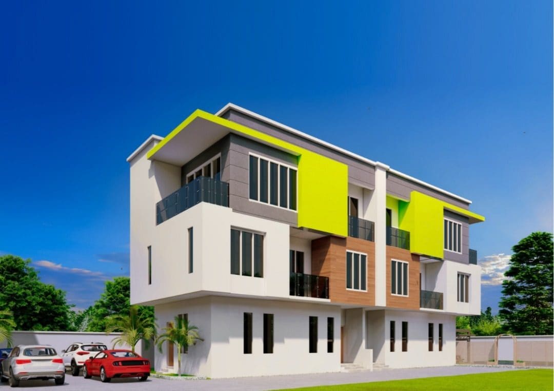 Three-quarter view of a Badella Flavinho apartment block at Ewang Estate, showing three storeys in white render with charcoal panels, timber-clad entrance bays and lime accent bands above the balconies.
